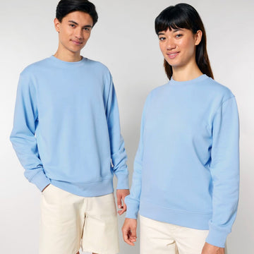 Two models wearing matching STSU178 Stella/Stella Changer 2.0 The Iconic Unisex crew neck sweatshirts made of organic cotton and cream pants.