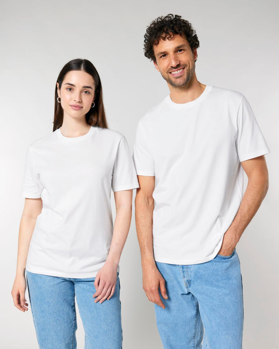 A man and woman wearing Stanley/Stella Creator 2.0 The Iconic Unisex T-shirts.