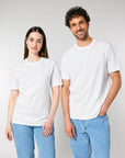 Two people standing side by side wearing Stanley/Stella Creator 2.0 The Iconic Unisex T-Shirts and blue jeans.