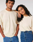 A man and woman in matching Stanley/Stella STTU815 Blaster Oversized High Neck Organic Cotton Unisex T-shirts posing for a picture.
