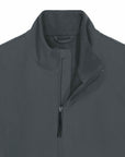 Close-up view of a gray windproof zip-up MyNeedsAreSimple STJM167 Stanley/Stella Navigator Men's Non-Hooded Softshell jacket with a high collar.