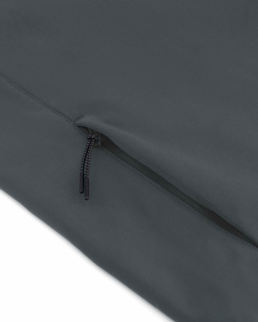 Close-up of a black zipper on a water repellent, dark MyNeedsAreSimple softshell fabric, displaying the zipper pull and teeth details of the STJM167 Stanley/Stella Navigator Men's Non-Hooded Softshell.