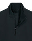 Close-up of a MyNeedsAreSimple black water-repellent STJM167 Stanley/Stella Navigator Men's Non-Hooded Softshell zip-up jacket with a high collar, focusing on the upper chest and collar area.