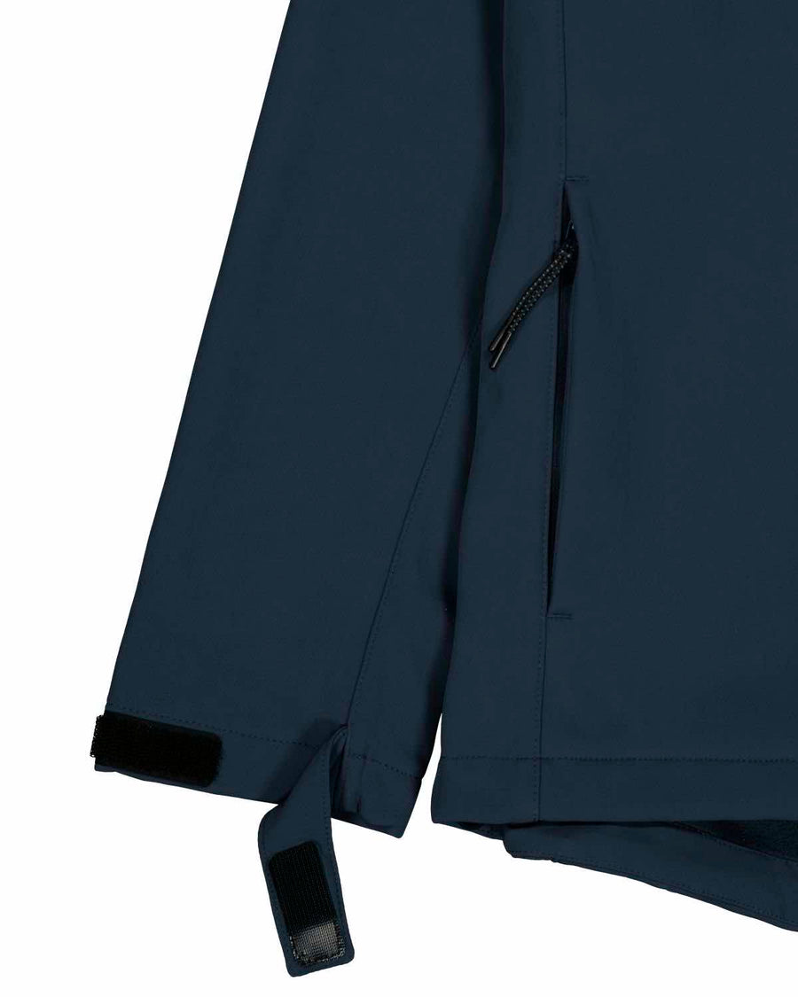 Close-up of a MyNeedsAreSimple STJM167 Stanley/Stella Navigator Men's Non-Hooded Softshell jacket in navy blue with a zipper detail and adjustable Velcro strap on the sleeve.