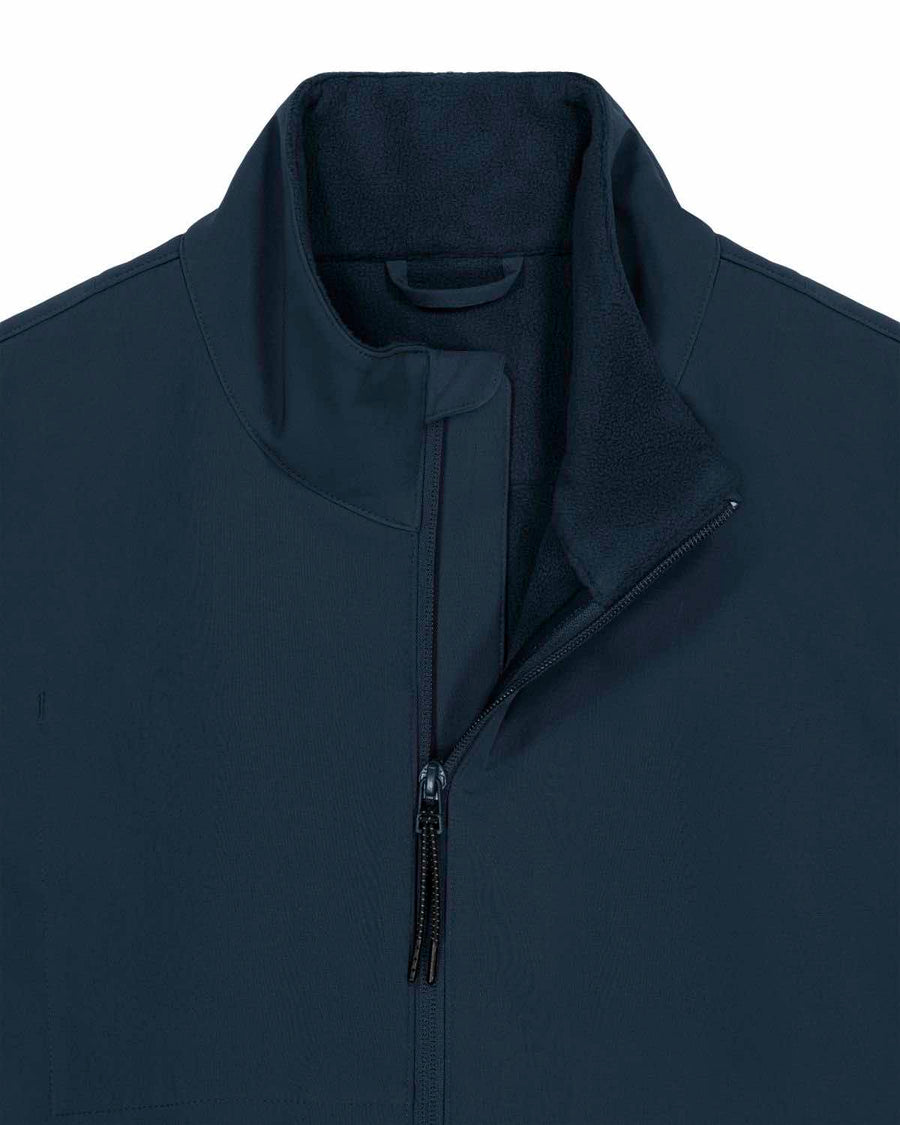 Close-up of a navy blue MyNeedsAreSimple STJM167 Stanley/Stella Navigator Men's Non-Hooded Softshell jacket with a zippered front and raised collar.