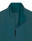 Close-up of a teal MyNeedsAreSimple STJM167 Stanley/Stella Navigator Men's Non-Hooded Softshell jacket featuring a high collar and metal zipper.