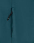 A closed, dark zipper on a textured teal recycled polyester fabric background of the STJM167 Stanley/Stella Navigator Men's Non-Hooded Softshell by MyNeedsAreSimple.
