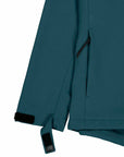 Close-up of a dark teal MyNeedsAreSimple STJW166 Stanley/Stella Navigator Women’s Non-Hooded Softshell jacket sleeve featuring a zipper detail and adjustable velcro strap on a white background.