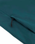 Close-up of a dark teal, water-repellent fabric with a black zipper, highlighting the texture and zipper details of the STJW166 Stanley/Stella Navigator Women’s Non-Hooded Softshell by MyNeedsAreSimple.