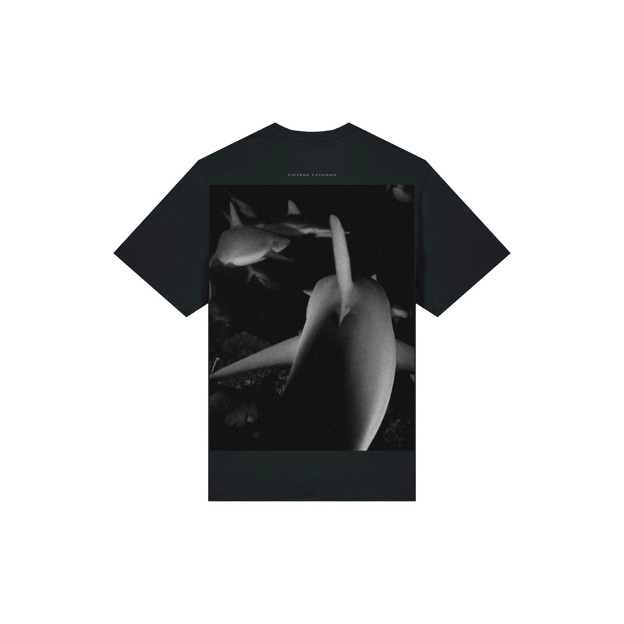 This Stanley/Stella STTU171 Sparker 2.0 Black (C002) Unisex Heavy T-Shirt features a striking grayscale image of sharks on the back, crafted from premium Organic Carded Cotton for superior comfort.