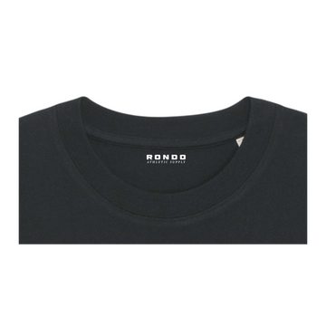 Close-up of a black crew neck T-shirt made from organic cotton with the label showing "Stanley/Stella" in white text near the collar. This unisex heavy weight T-shirt, the STTU788 Stanley/Stella Freestyler Heavy Organic Cotton Unisex T-Shirt, has been fabric washed for added softness and durability.