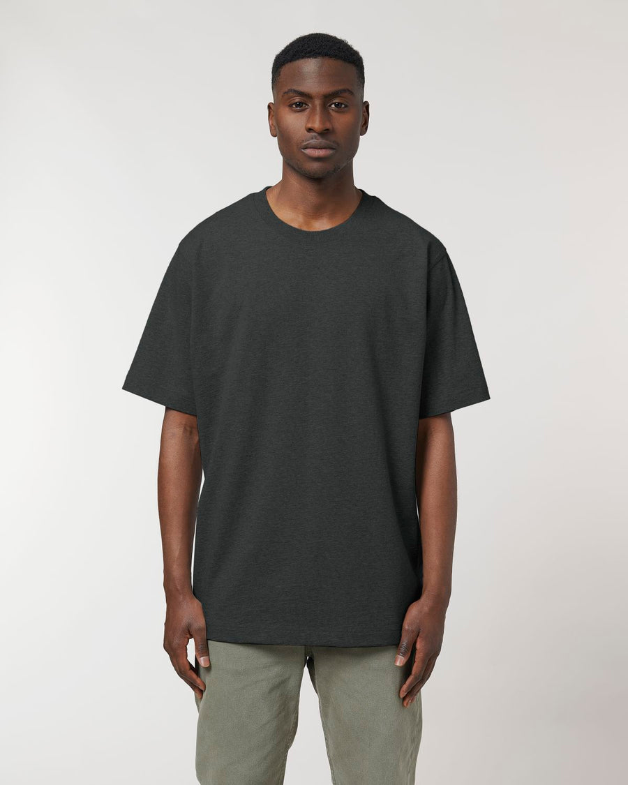 The man is wearing a Stanley/Stella Freestyler Heavy Organic Cotton Unisex T-shirt made of organic cotton and khaki pants.