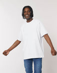 A man wearing a Stanley/Stella Freestyler Heavy Organic Cotton Unisex T-shirt and jeans.