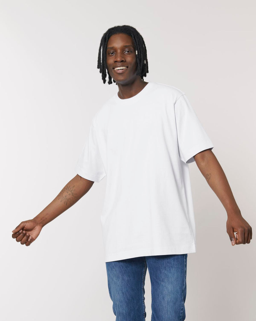 A man wearing a Stanley/Stella Freestyler Heavy Organic Cotton Unisex T-shirt and jeans.