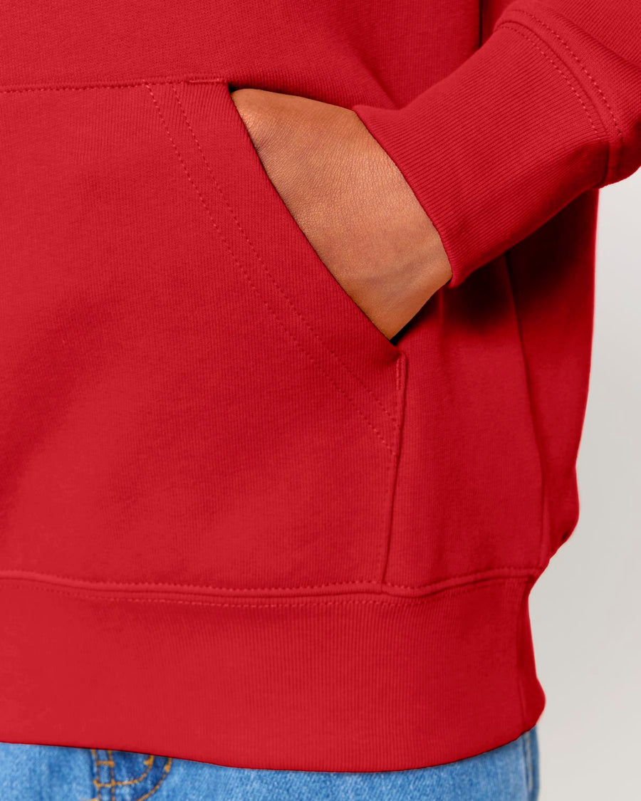 A man wearing a red STSK180 Stella kids' hoodie with a pocket.