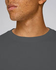 A Close up of a Stanley/Stella Organic Cotton Sweatshirt in Anthracite worn by a male model