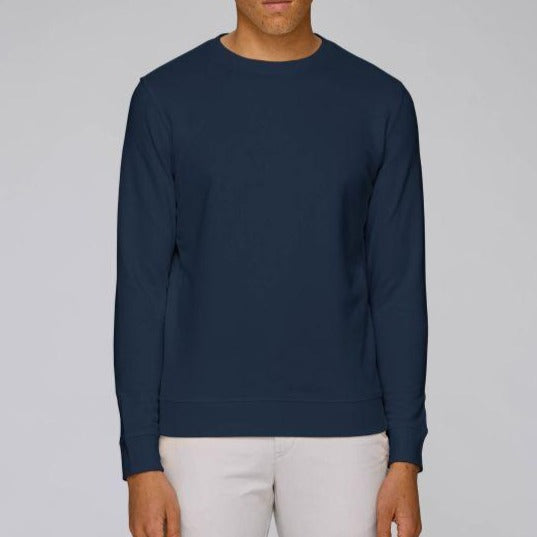 A Stanley/Stella Rise eco-friendly Sweatshirt in French Navy worn by a male model