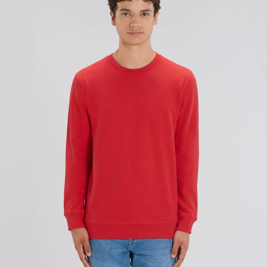 A Stanley/Stella Rise sustainable Sweatshirt in red worn by a male model