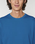 A Stanley/Stella Rise eco-friendly Sweatshirt in Royal Blue worn by a male model