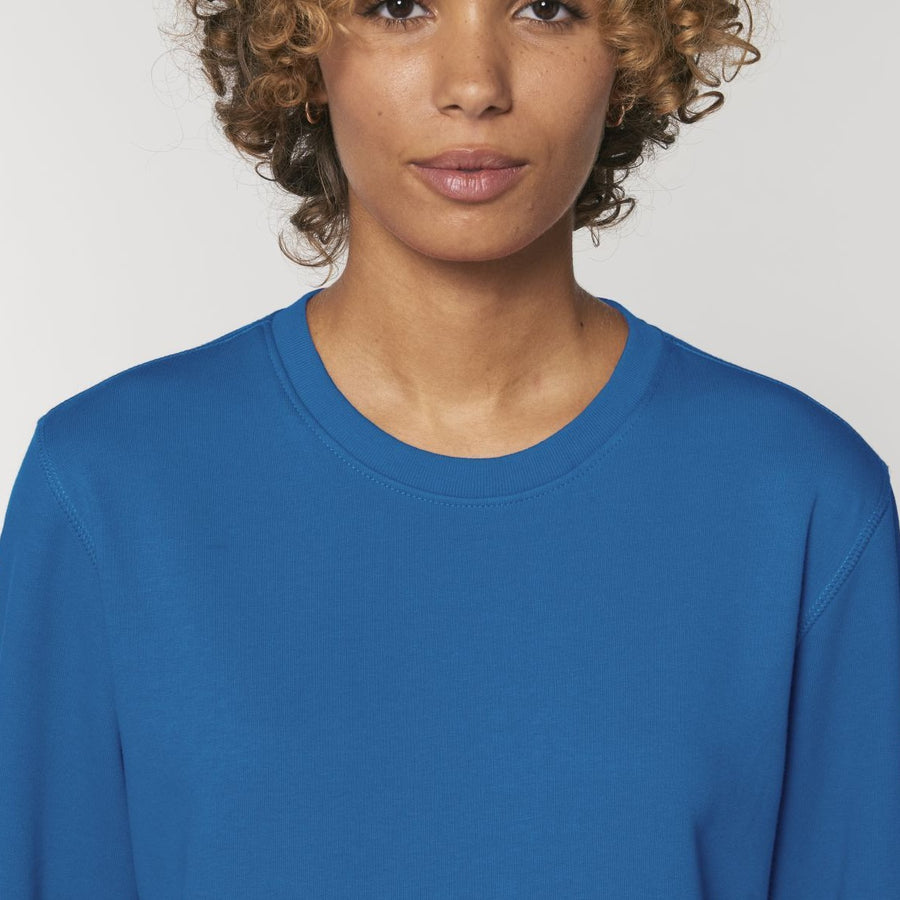 A Stanley/Stella Rise Organic Cotton Sweatshirt in Royal Blue worn by a male model