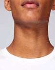 A neck view of a Stanley/Stella white eco-friendly Sweatshirt worn by a male model