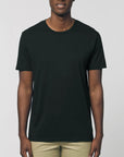 A male model wearing an organic black Stanley/Stella rocker T-Shirt
