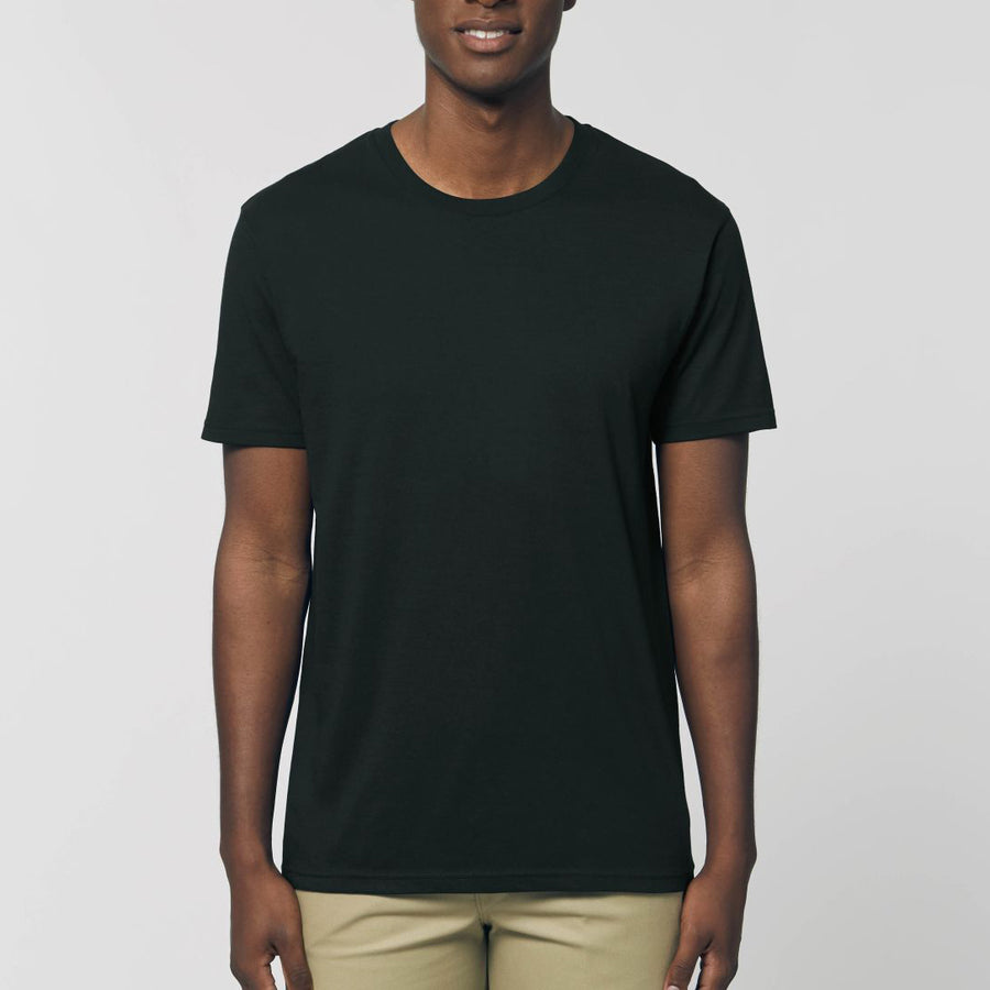 A male model wearing an organic black Stanley/Stella rocker T-Shirt