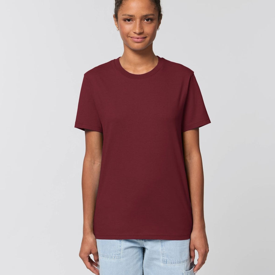 A female model wearing an organic burgundy Stanley/Stella rocker T-Shirt