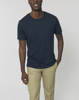 A male model wearing an organic French Navy Stanley/Stella rocker T-Shirt