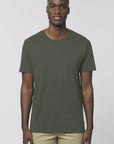 A male model wearing an organic khaki Stanley/Stella rocker T-Shirt