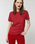 A female model wearing an organic red Stanley/Stella rocker T-Shirt