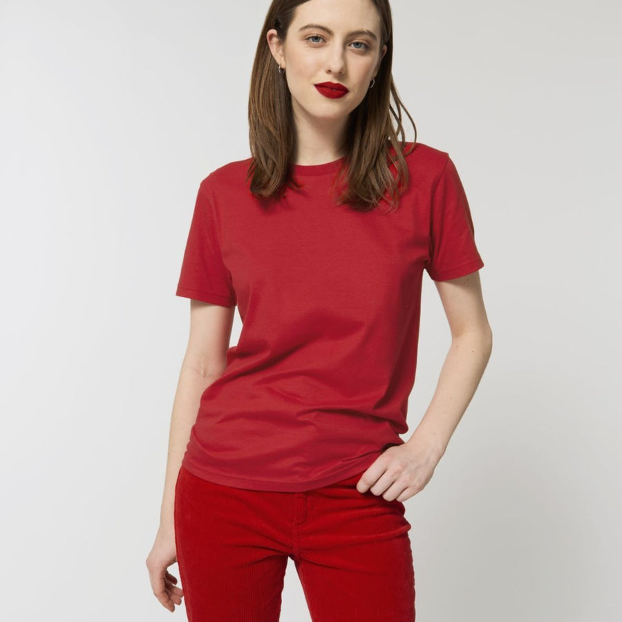 A female model wearing an organic red Stanley/Stella rocker T-Shirt