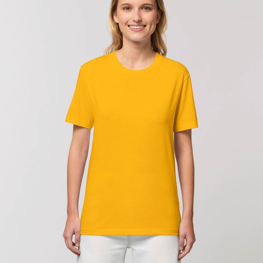 A female model wearing an organic yellow Stanley/Stella rocker T-Shirt