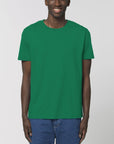 A male model wearing an organic varsity green Stanley/Stella rocker T-Shirt