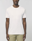 A male model wearing an organic white Stanley/Stella rocker T-Shirt
