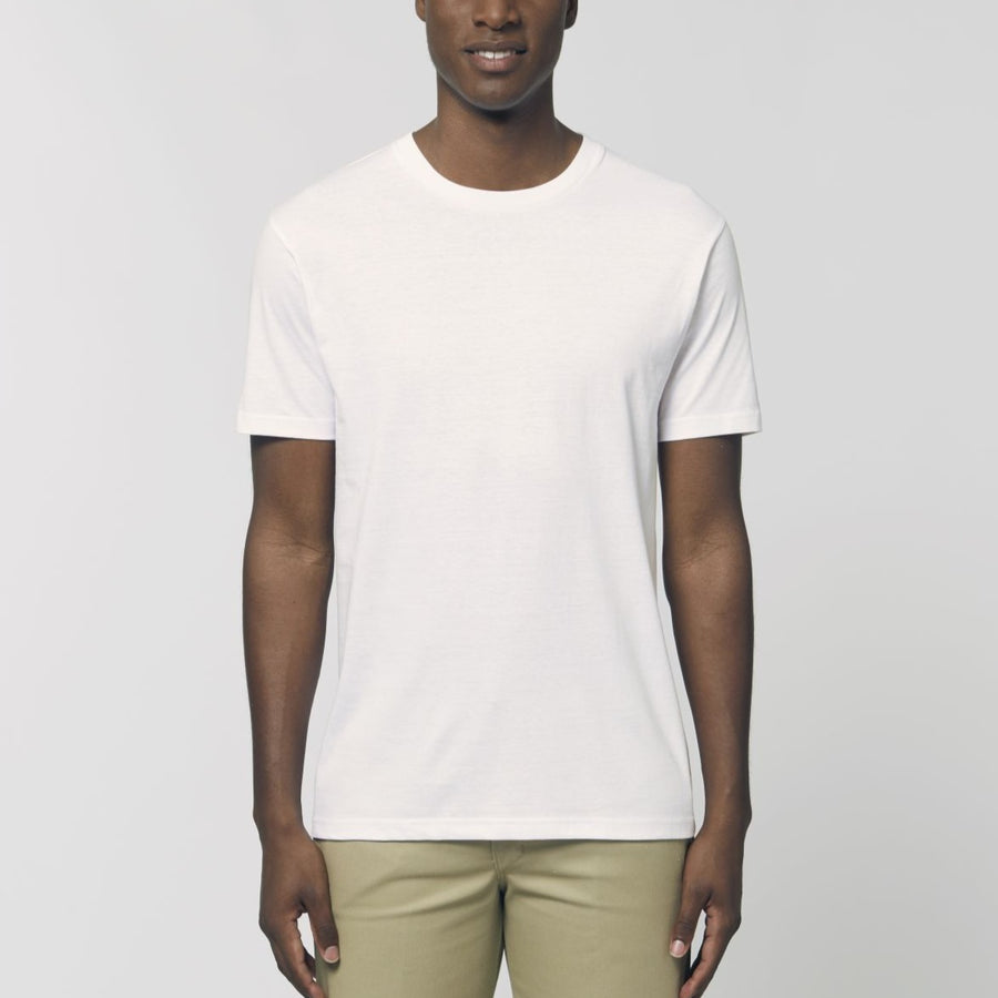 A male model wearing an organic white Stanley/Stella rocker T-Shirt
