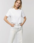 A female model wearing an organic white Stanley/Stella rocker T-Shirt