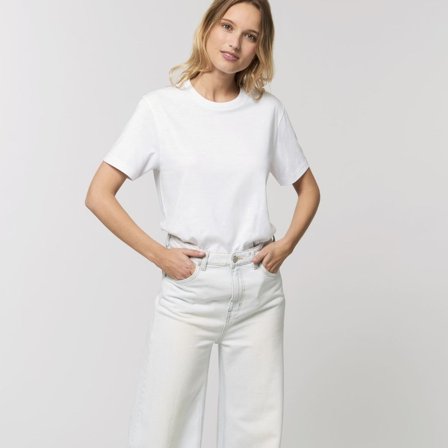 A female model wearing an organic white Stanley/Stella rocker T-Shirt