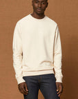 A male model wearing a Stanley/Stella organic cotton sweatshirt