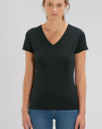 A female model wearing a Stanley/Stella Ladies black evoker v neck T-Shirt