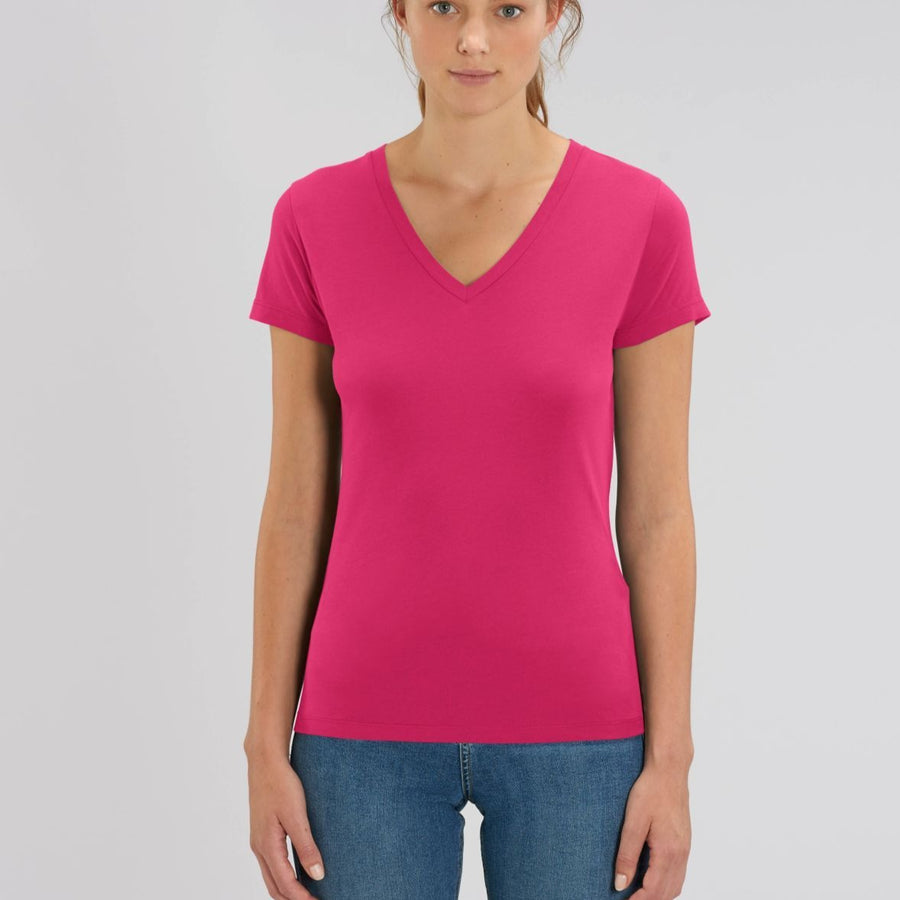 A female model wearing a Stanley/Stella Ladies raspberry evoker v neck T-Shirt