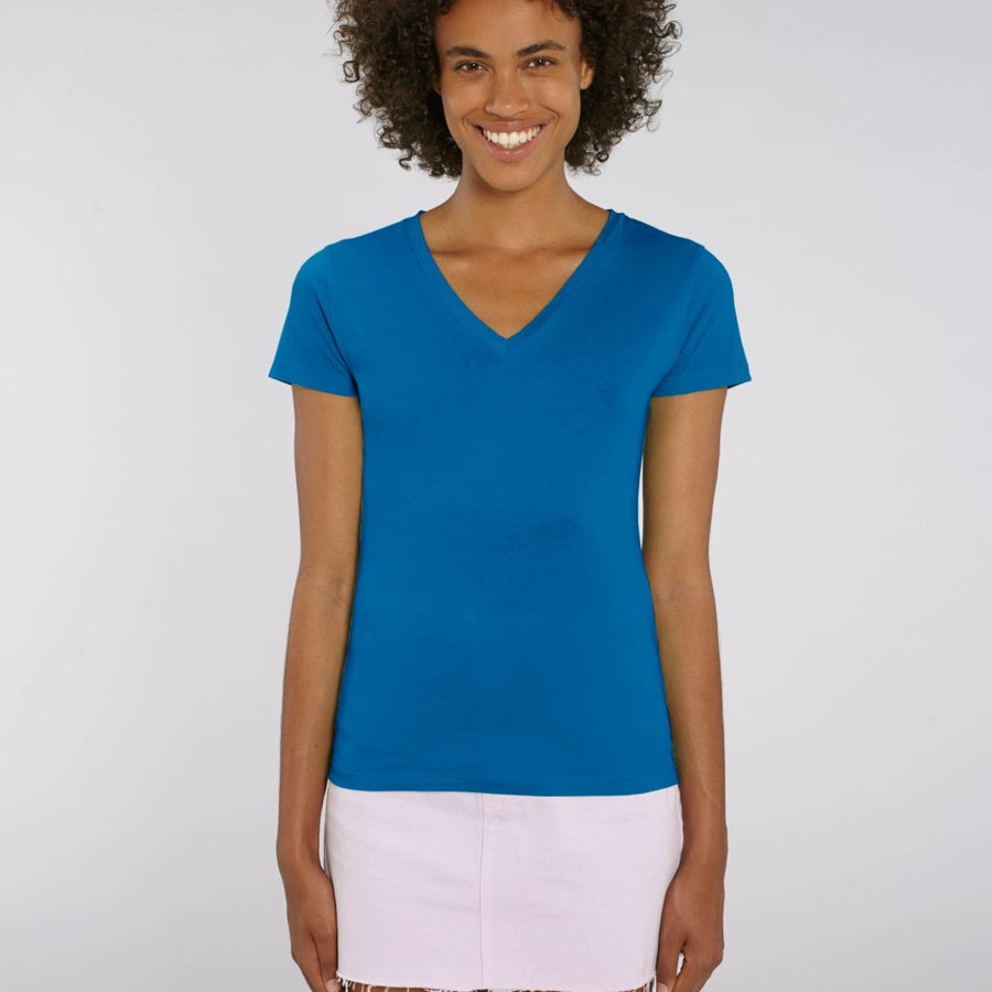 A female model wearing a Stanley/Stella Ladies royal blue evoker v neck T-Shirt